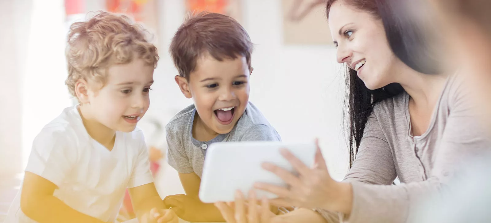 Students using digital tools to learn about biodiversity in a classroom setting.